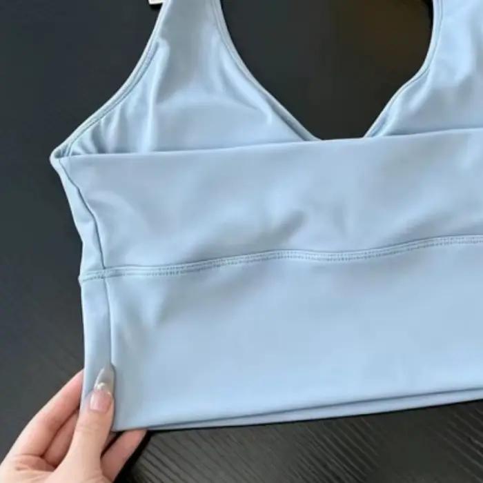 Soutien-gorge de yoga dos nu à col en V profond pour femme, en tissu soyeux et lisse, haut de sport tendance