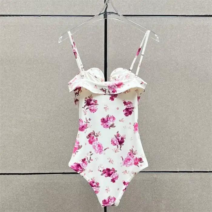 Nouveau body femme élastique ajusté à bretelles sans manches pour l'été 2026, avec décoration florale 3D, style corset