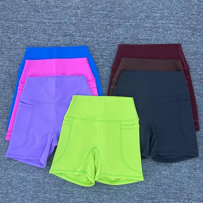 Shorts sportifs pour femmes en nylon et élasthanne avec poche droite pour yoga et fitness